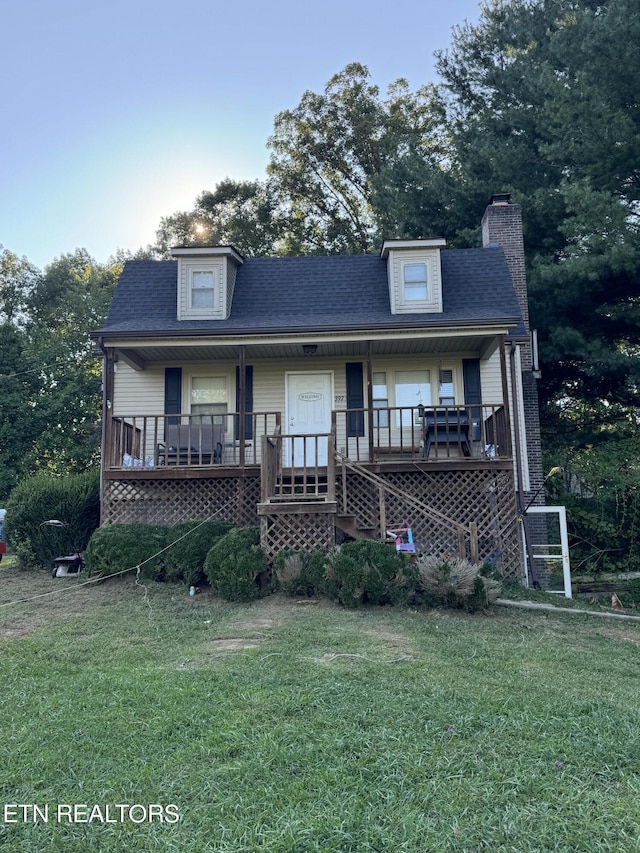 view of front facade with a porch and a front yard