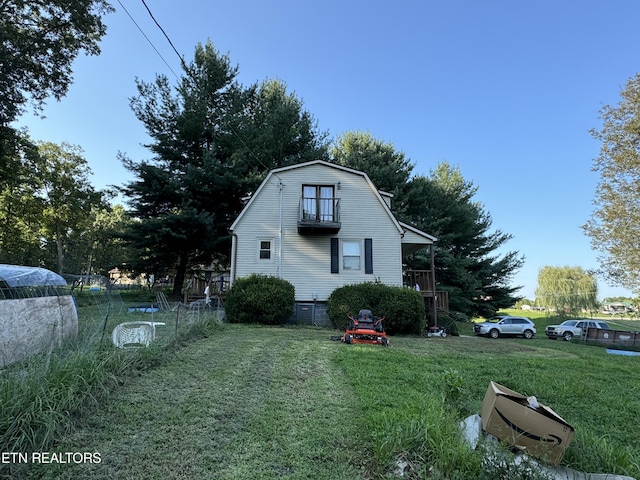 view of property exterior with a lawn