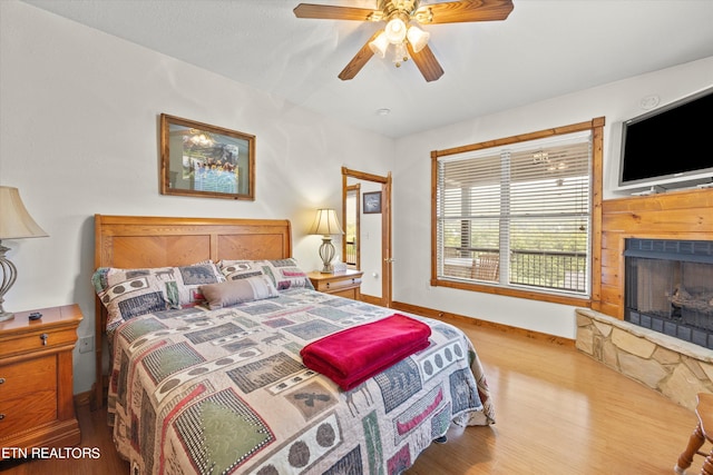 bedroom featuring ceiling fan and light hardwood / wood-style floors