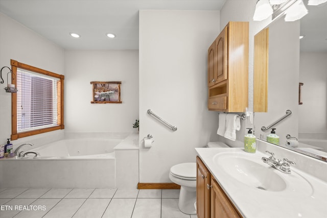 bathroom featuring a tub, toilet, tile patterned floors, and vanity