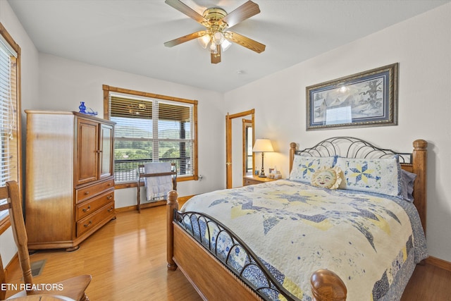 bedroom featuring light wood-type flooring and ceiling fan