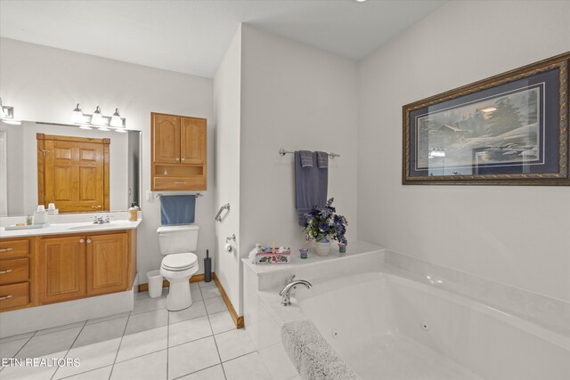 bathroom with toilet, a bathing tub, vanity, and tile patterned flooring