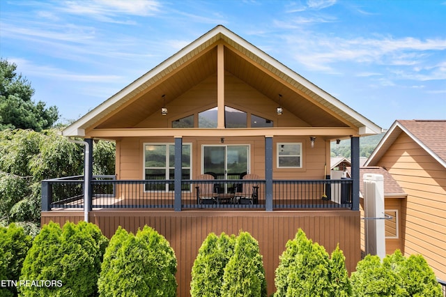 back of house featuring a deck