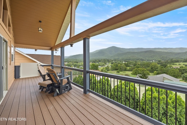 wooden terrace featuring a mountain view