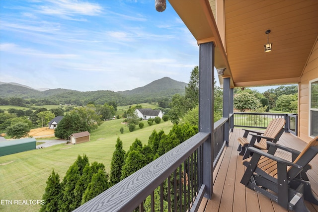 wooden deck with a mountain view