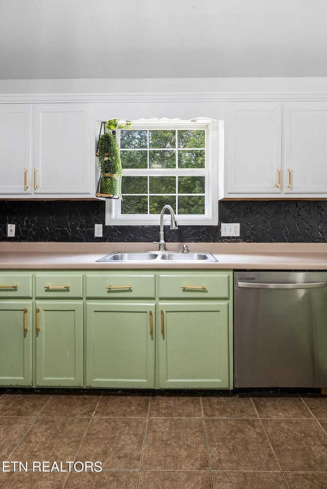 kitchen featuring sink, dishwasher, dark tile patterned floors, and decorative backsplash