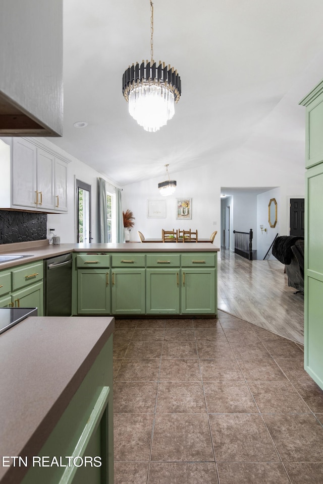 kitchen with decorative backsplash, hanging light fixtures, wood-type flooring, dishwasher, and lofted ceiling