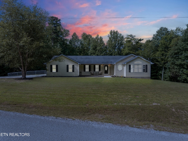 ranch-style house with a lawn