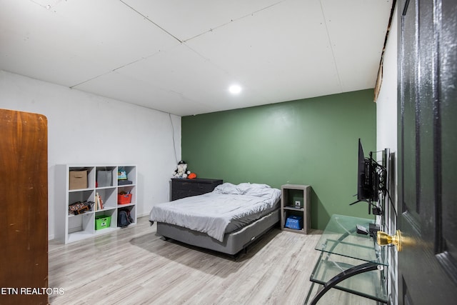 bedroom with light wood-type flooring