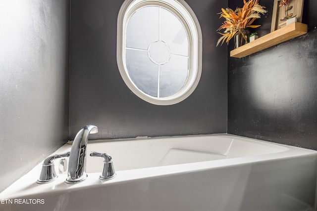 bathroom with a washtub