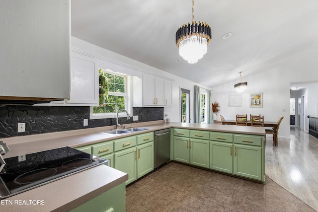 kitchen with a wealth of natural light, vaulted ceiling, stainless steel dishwasher, and sink