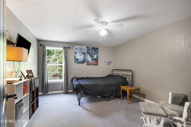 bedroom featuring ceiling fan and carpet flooring