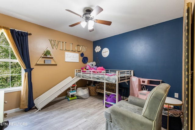 bedroom with ceiling fan and hardwood / wood-style floors