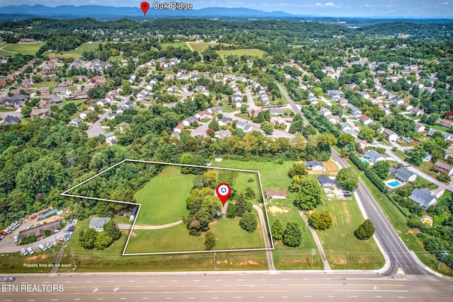 birds eye view of property with a residential view and a mountain view