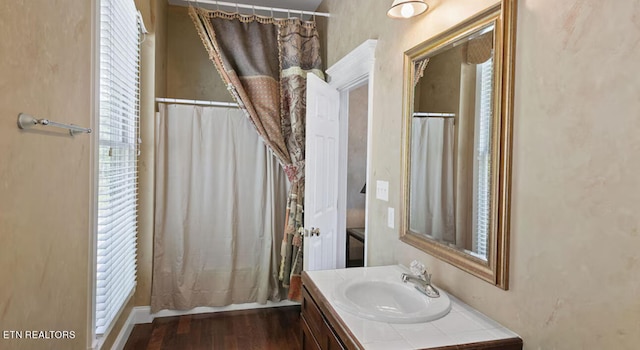 bathroom featuring vanity and hardwood / wood-style flooring