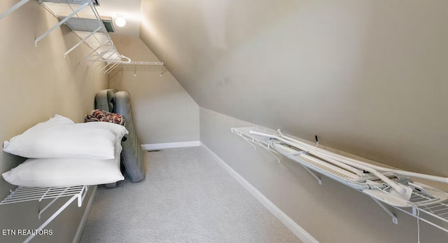 carpeted bedroom featuring vaulted ceiling