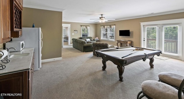 game room featuring ceiling fan, billiards, ornamental molding, and light carpet