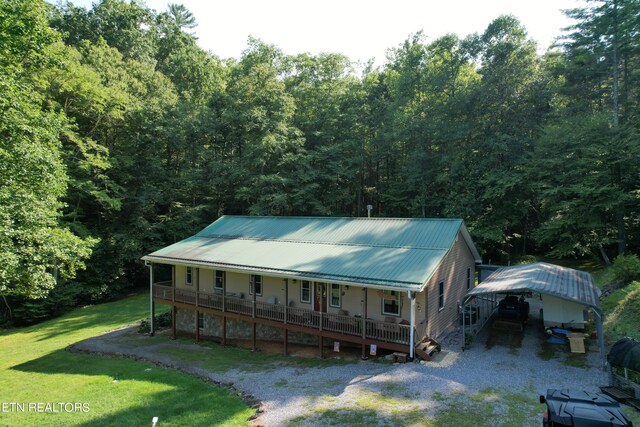 view of front of property with a front yard and covered porch