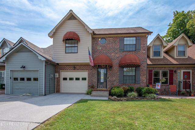 view of front facade featuring a front yard and a garage