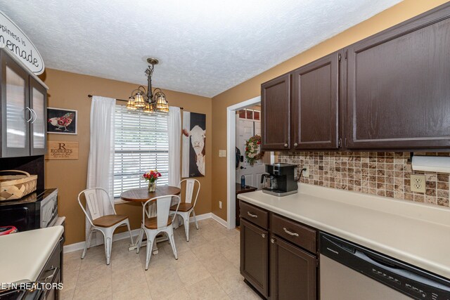 kitchen with pendant lighting, light tile patterned floors, a notable chandelier, dishwasher, and tasteful backsplash