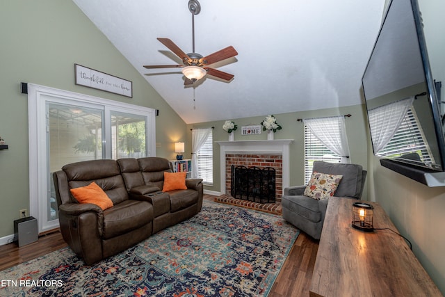 living room with ceiling fan, plenty of natural light, and hardwood / wood-style flooring