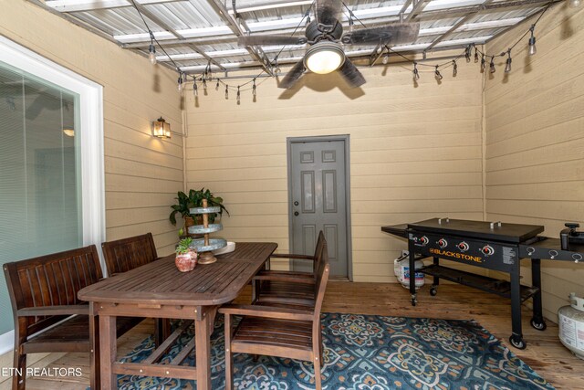 dining area featuring ceiling fan and hardwood / wood-style flooring