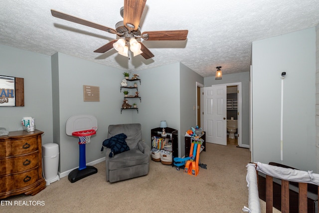 interior space featuring ceiling fan, a textured ceiling, and carpet floors