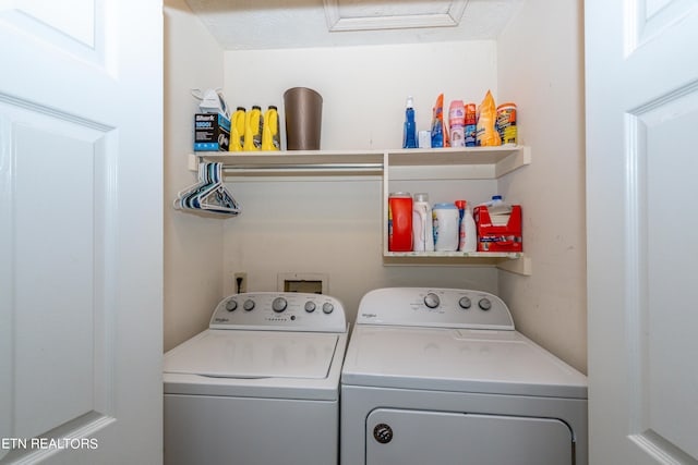 laundry area featuring a textured ceiling and separate washer and dryer