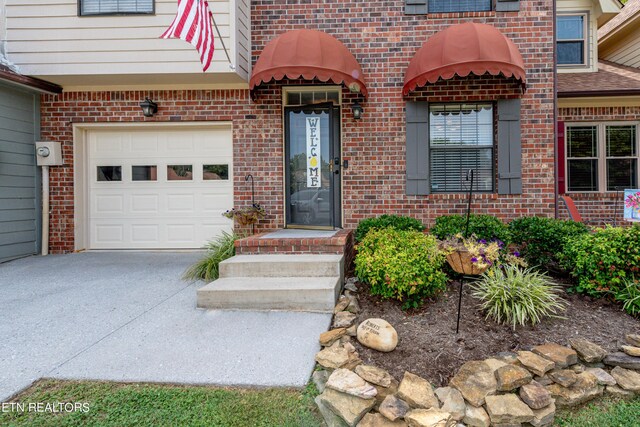 entrance to property featuring a garage