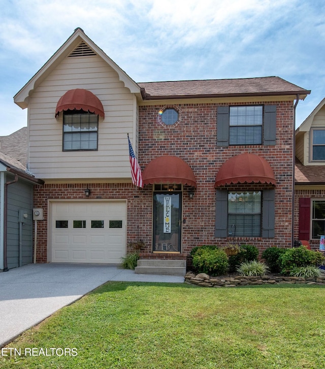 view of front of home featuring a front lawn and a garage