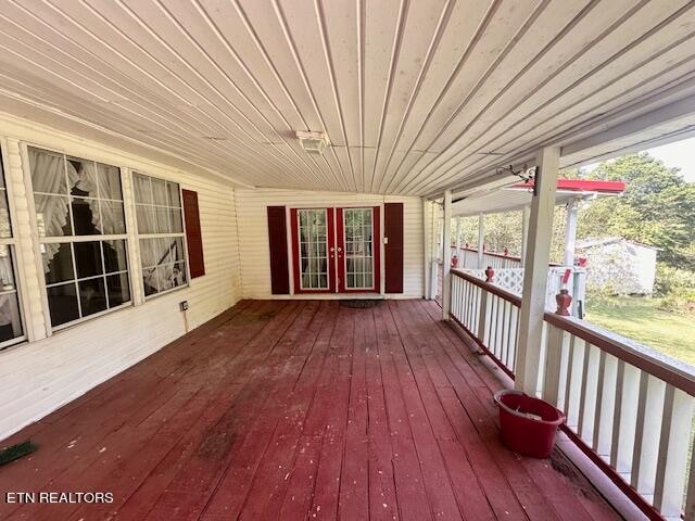 wooden deck featuring french doors