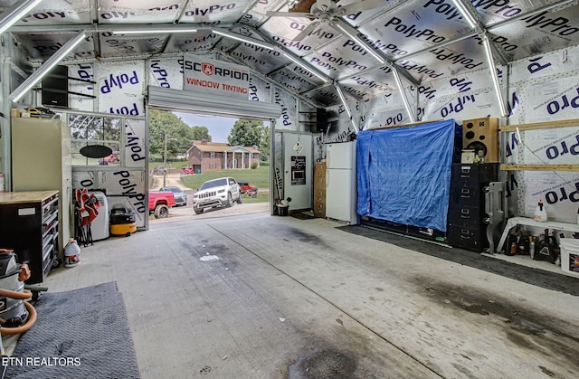 garage with white fridge