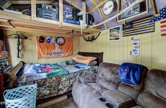 bedroom with wooden walls