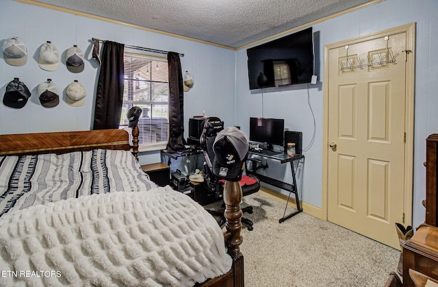 bedroom featuring carpet, a textured ceiling, and ornamental molding