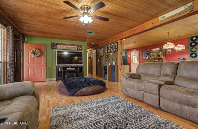 living room featuring ceiling fan, wooden ceiling, and hardwood / wood-style floors