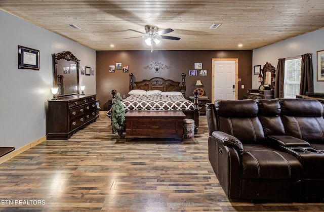 bedroom with wood-type flooring and ceiling fan