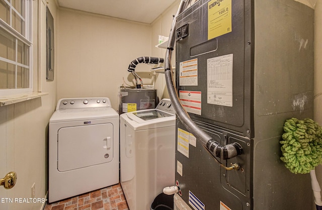 laundry room featuring washer and dryer, heating unit, and water heater