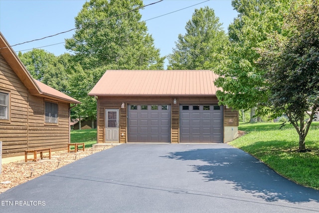 garage with a yard