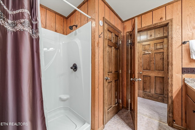 bathroom with tile patterned floors, wooden walls, vanity, and a shower with curtain