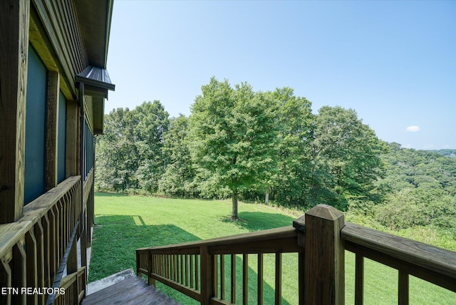 wooden terrace with a yard