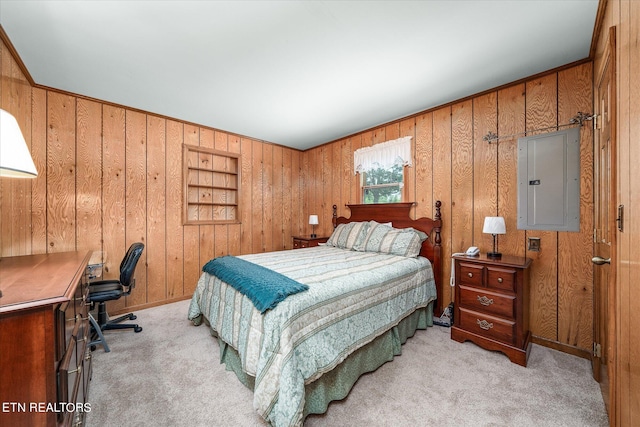 carpeted bedroom with wooden walls and electric panel