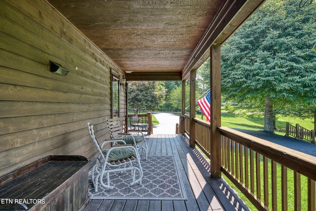 wooden deck with a yard