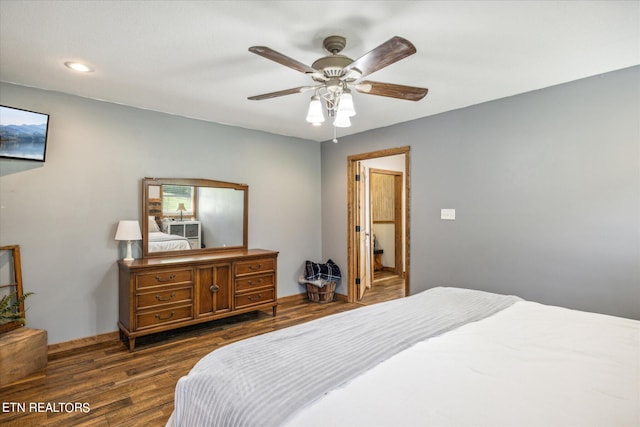 bedroom with ceiling fan and dark wood-type flooring