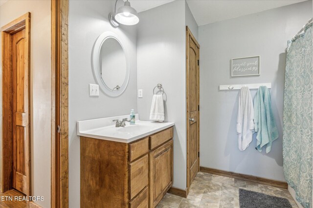 bathroom featuring vanity and tile patterned flooring