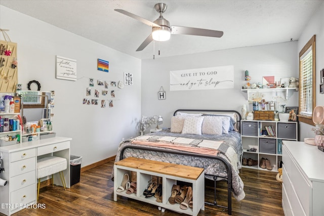 bedroom featuring ceiling fan, a textured ceiling, and wood-type flooring