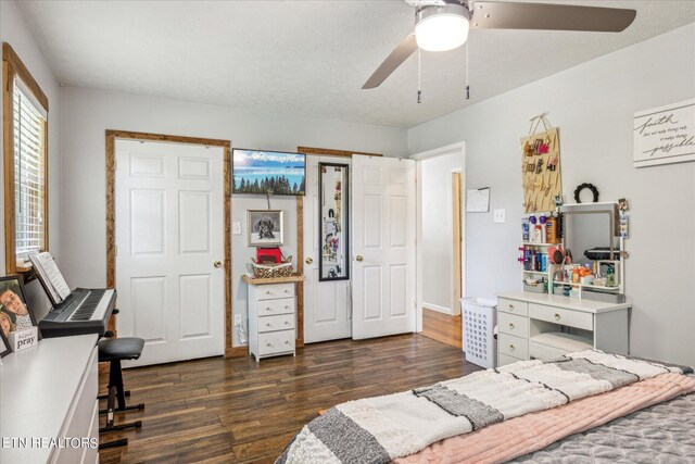 bedroom featuring dark hardwood / wood-style flooring and ceiling fan