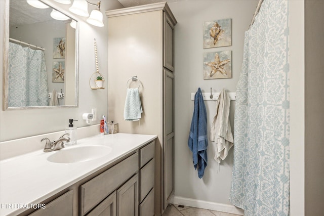 bathroom with tile patterned floors and vanity