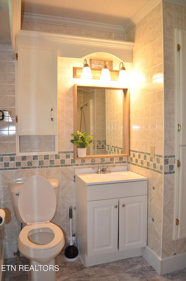 bathroom featuring tile walls, toilet, tile patterned floors, and crown molding