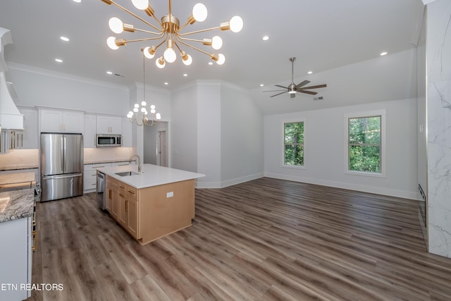 kitchen featuring white cabinetry, an island with sink, sink, dark hardwood / wood-style flooring, and stainless steel appliances