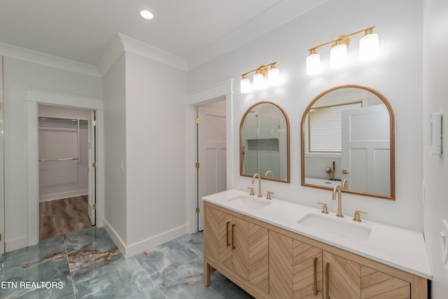 bathroom with crown molding and vanity